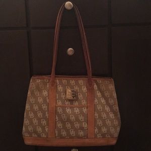 Dooney & Burke. Well loved. shows wear and tear.